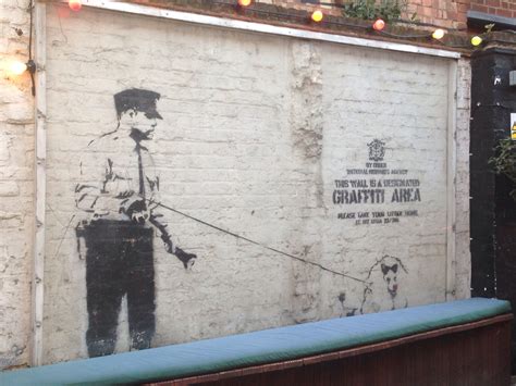 New Banksy artwork taken from London street as crowd looks on